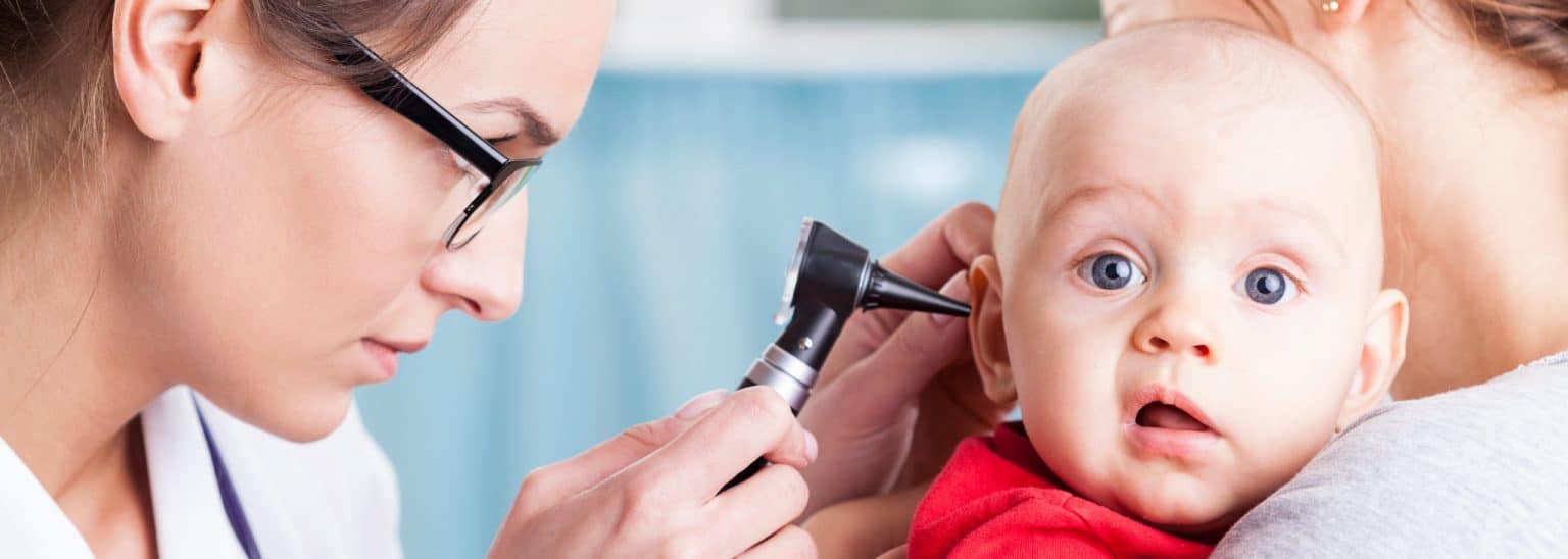 Young child undergoing a pediatric hearing screening